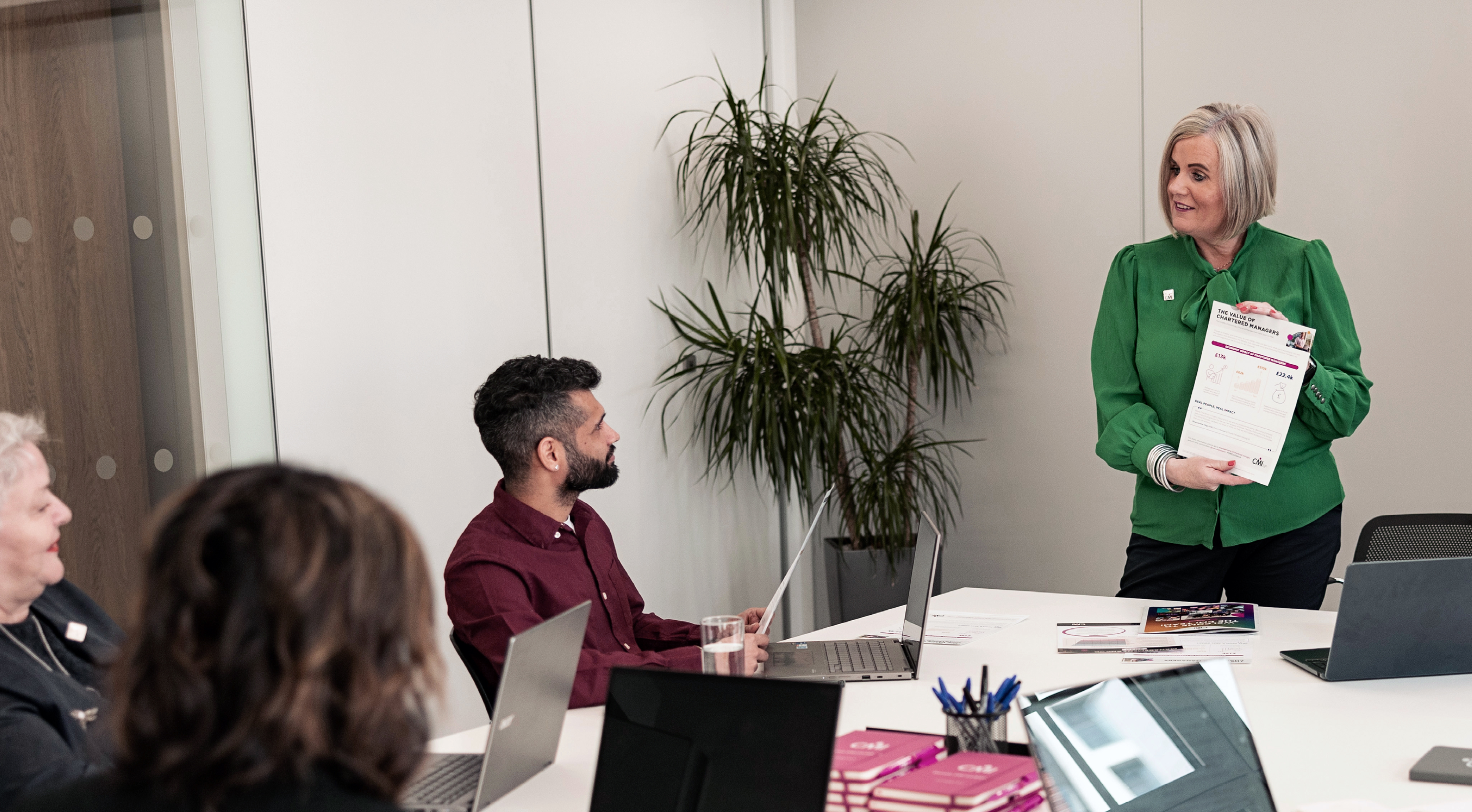 Table of people at CMI having a meeting